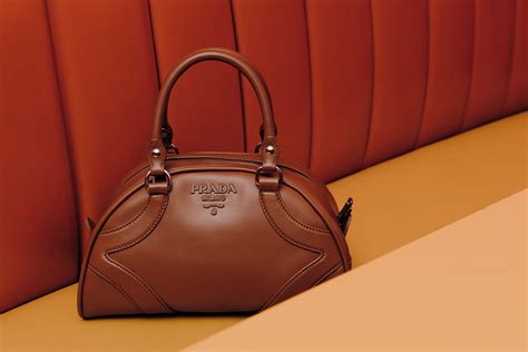 prada bowler goffrata con catena|The history of the Prada Bowling bag .